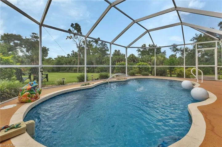 View of pool with glass enclosure