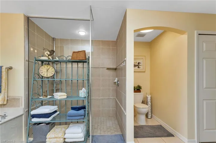 Bathroom featuring toilet and tile patterned floors