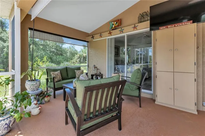 Sunroom / solarium with vaulted ceiling