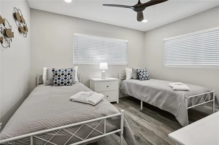 Bedroom featuring hardwood / wood-style flooring and ceiling fan