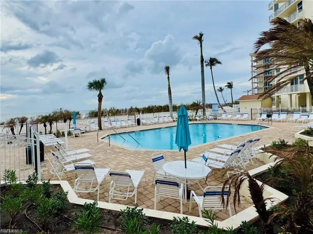 Community pool featuring a patio area