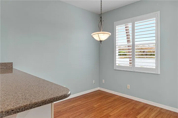 Dining Area off kitchen with sliders to the screened patio