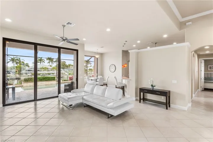 View of Great Room with eat-in kitchen area in background.