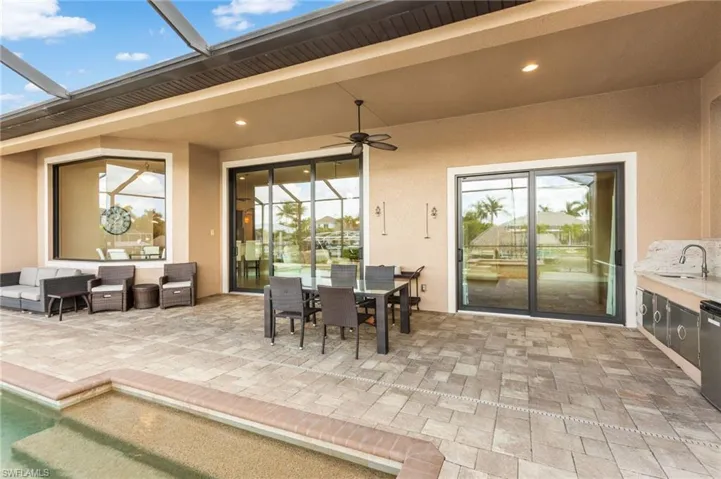 View of covered and screened lanai with impact resistant sliding doors and windows.