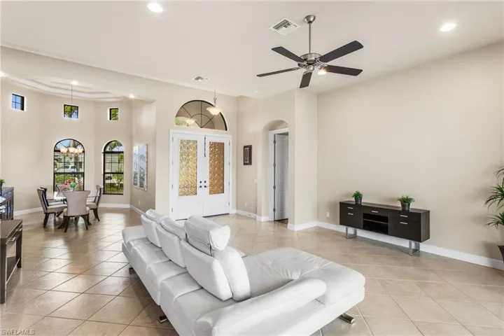 Great room looking towards front door and Formal Dining Room. Entry to Master Suite to right of front door.