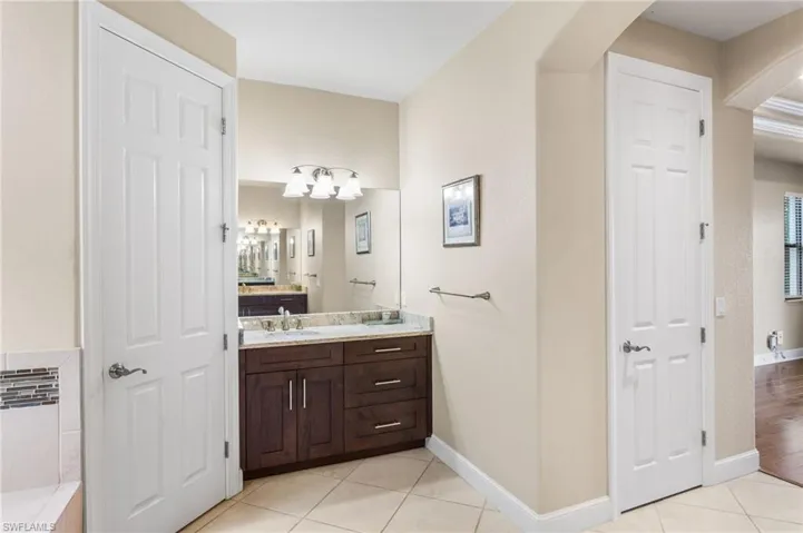 Master Bath with separate vanity, water closet on left, linen closet on right.