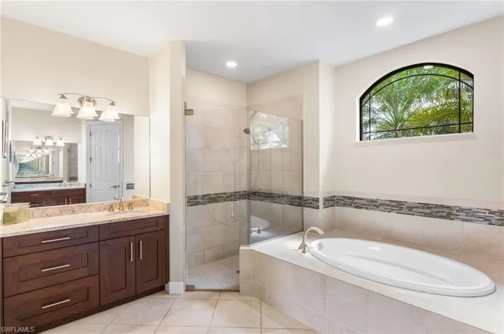 Master Bathroom with one of two separate vanities with granite top.