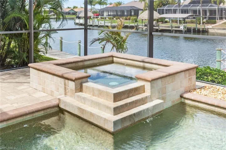 Heated Spa with Gulf access canal in background.