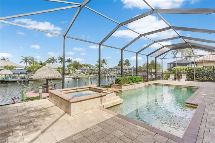 View of pool, spa, and dockside Tiki Hut.