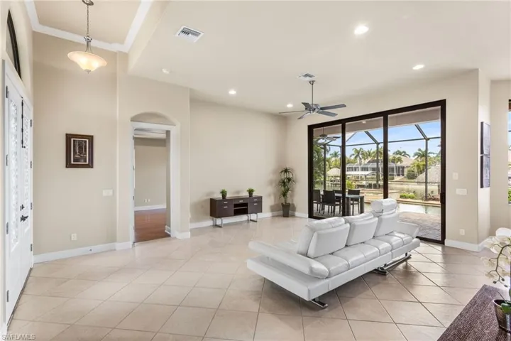 Great Room with tall Impact Sliders to the pool area.