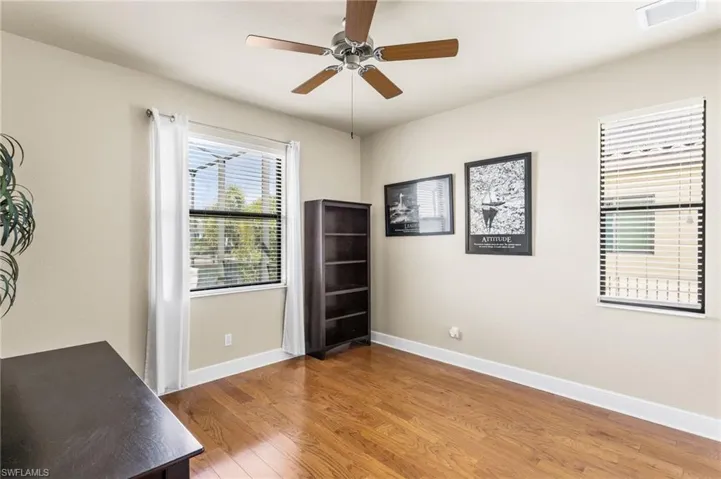One of three guest bedrooms. Has window view of pool area.