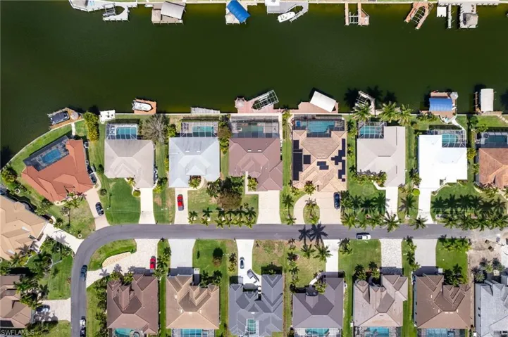 Aerial view of neighboring homes and the Gulf access canal.