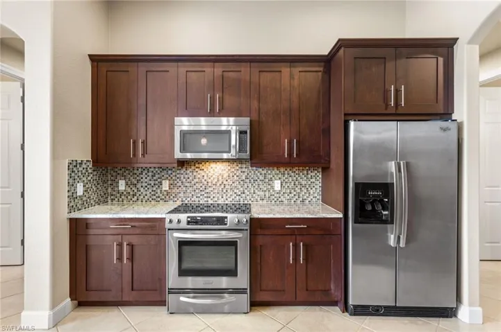 42 inch wooden cabinets and stainless steel appliances.