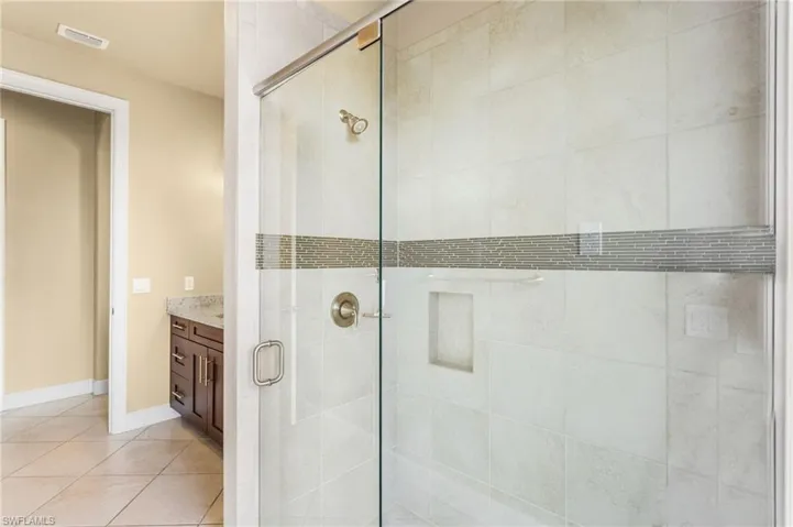 Second Bathroom/Pool Bathroom with glass walk-in shower door.