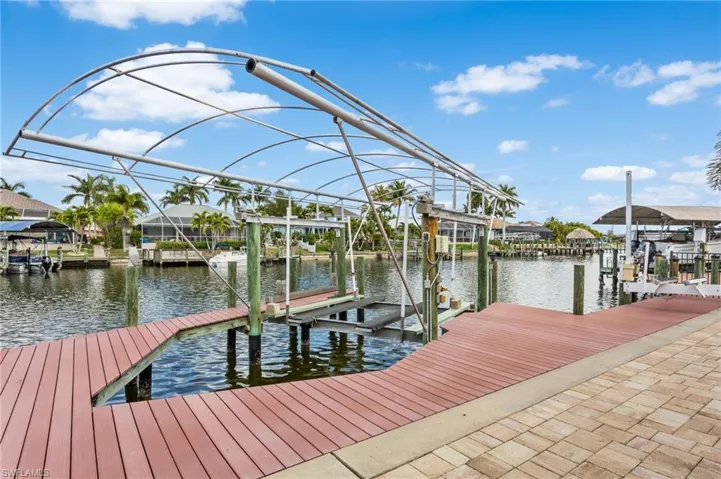 Composite dock with 10,000 lb. covered boat lift suitable for single and cat hulls. Newer lift cover stored in garage.