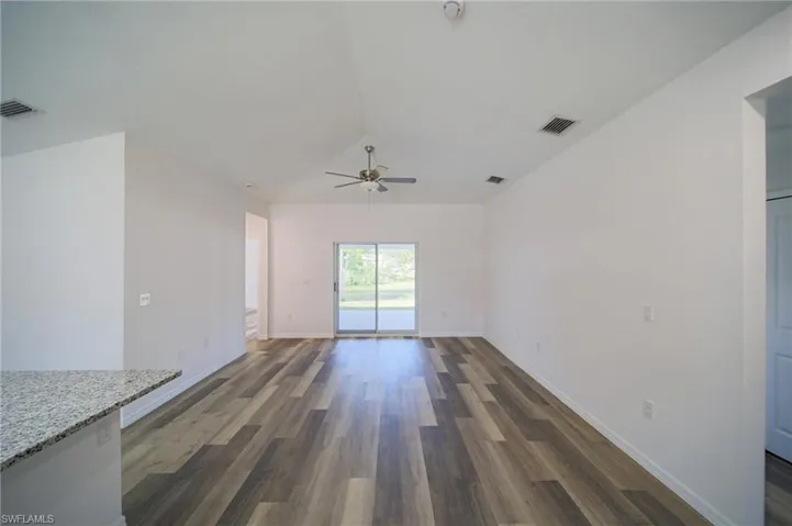 Large Living Room With Double Slider That Leads Out To A Covered Lanai!