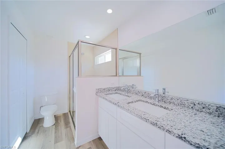Dual Sinks And A Walk-In Tiled Shower In The Master Bathroom!