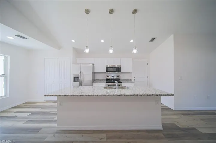 The Island-Breakfast Bar Can Seat An Entire Family Comfortably!