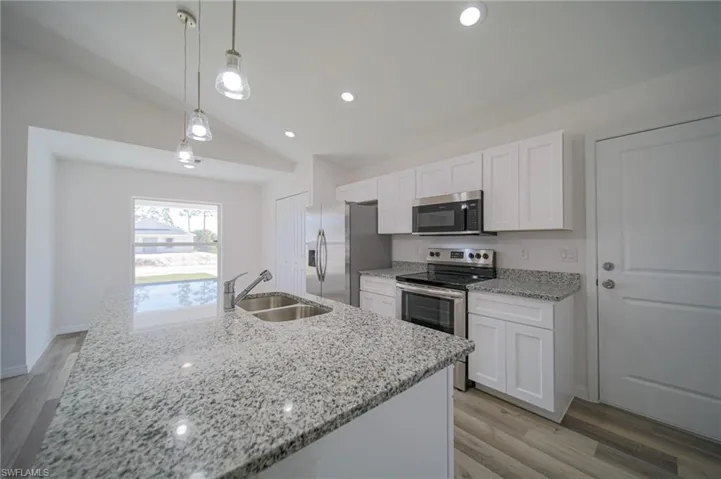 The Island Kitchen Comes With Granite Countertops And Backsplash, Stainless Steel Appliances, Real Wood White Cabinets And Drawers, A Large Walk-In Pantry, Pendant Lighting, And Stainless Steel Sink And Hardware!