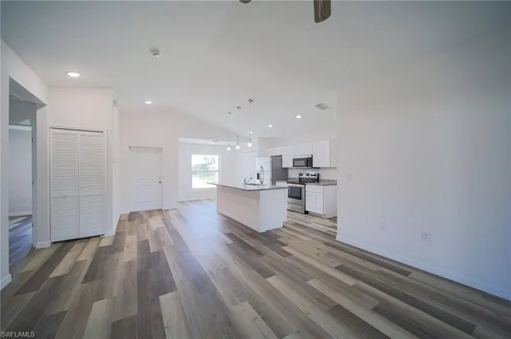 Large Living Room With Double Slider That Leads Out To A Covered Lanai!