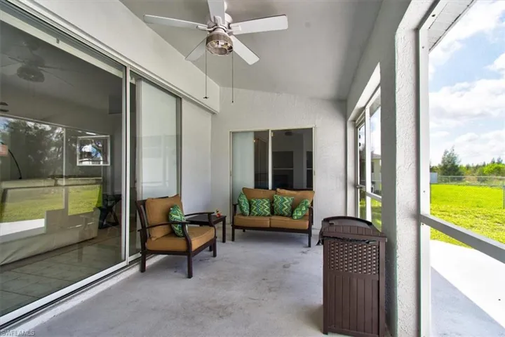 Sunroom / solarium with ceiling fan and lofted ceiling