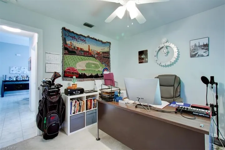 Home office featuring a ceiling fan
