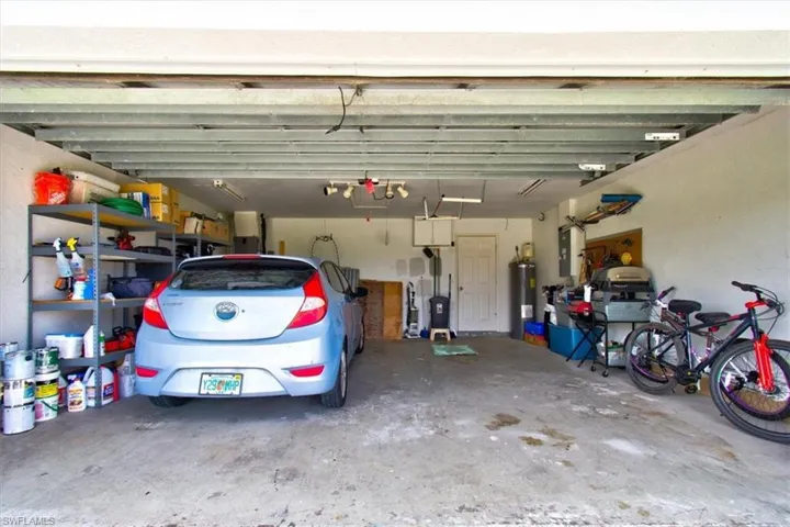 Garage with electric water heater and electric panel