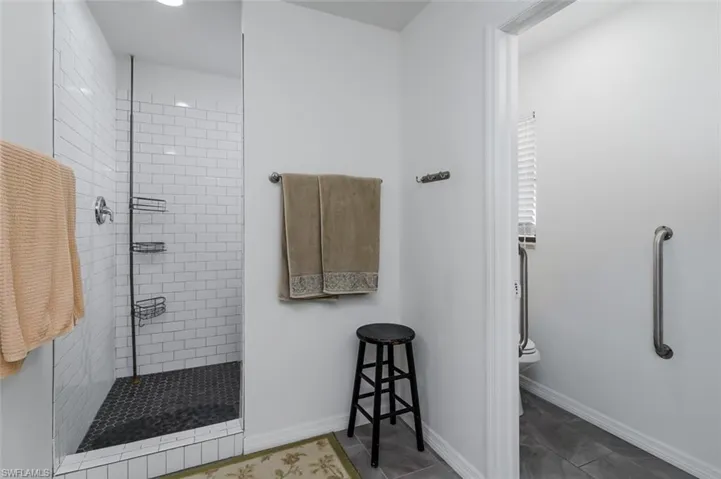Primary Full bathroom featuring walk in shower and toilet