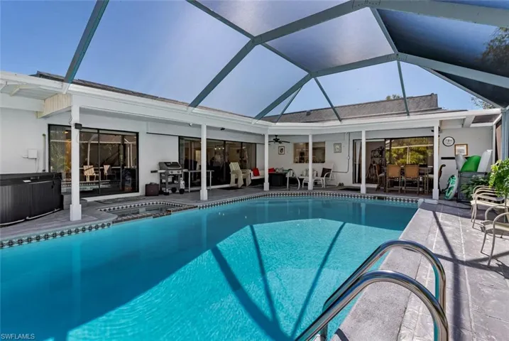 hot tub, patio, and area for grilling