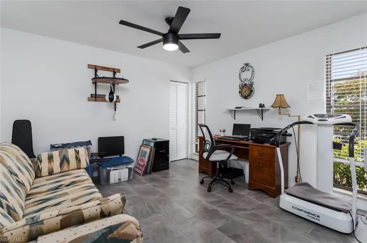 Bedroom or office with ceiling fan