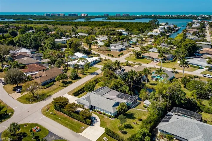 Aerial view of residential area featuring the gulf in the distance