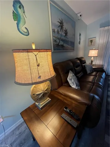 Warm wood-finish flooring complements the light blue wall paint