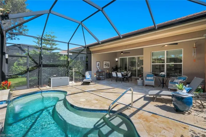 Electric hurricane shutters enclose the outdoor area and are great for shade and keeping this area nice and dry!