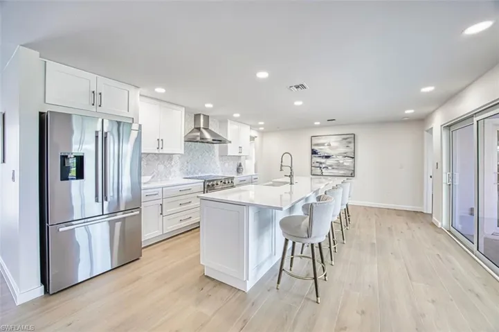 Kitchen with island and stainless steel finishes