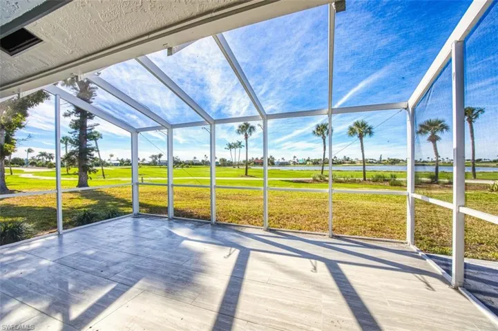 Unfinished sunroom with a water and golf course views