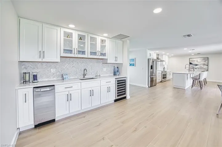 Wet bar with wine fridge and ice maker