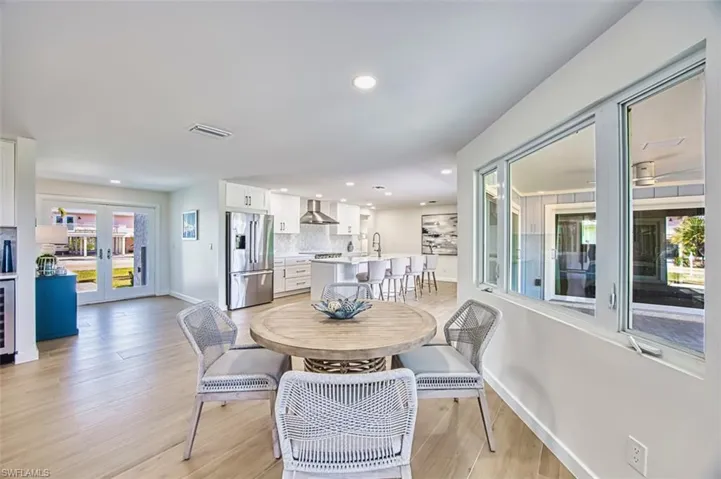 Dining space with view to foyer and kitchen