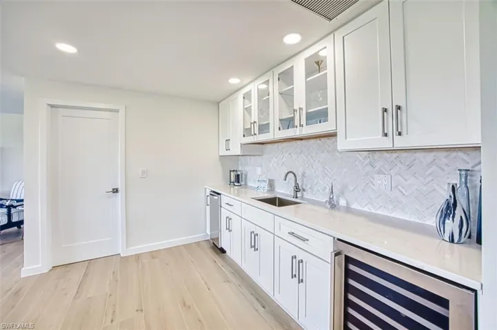 Wet bar with wine fridge and ice maker
