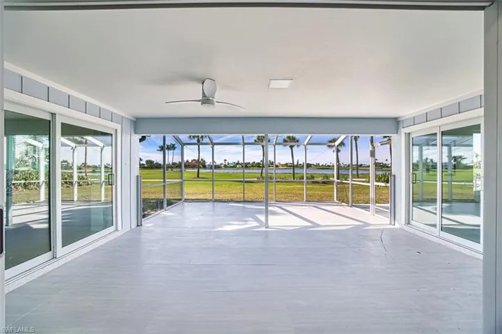 Unfinished sunroom with a water and golf course views
