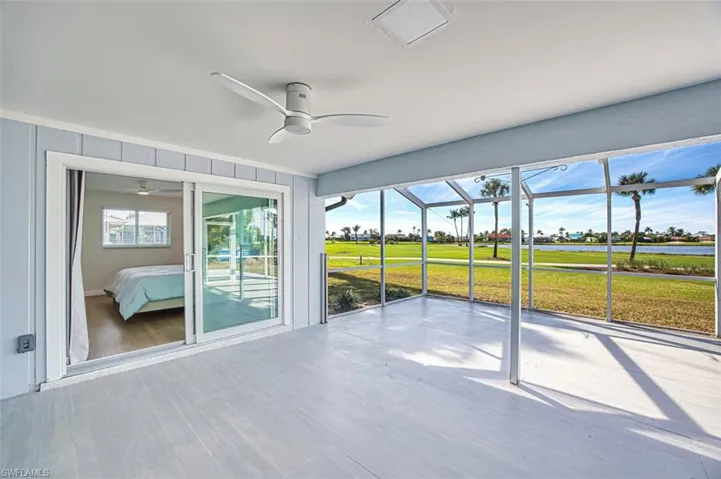Unfinished sunroom with a water and golf course views