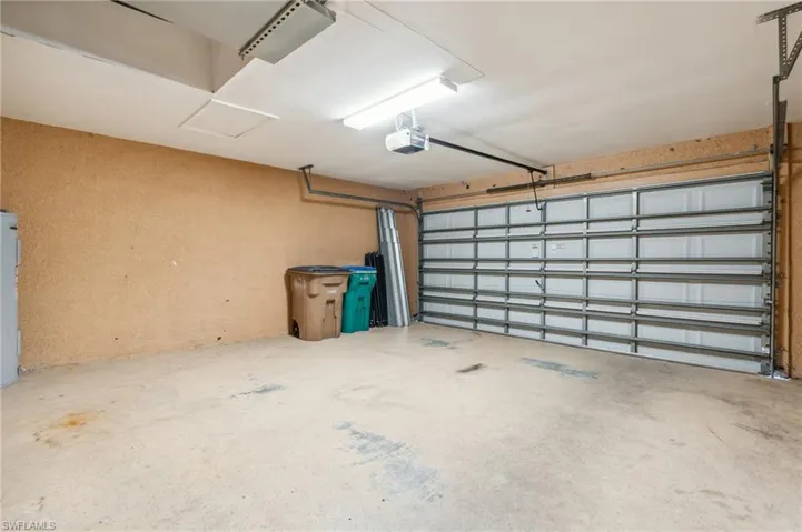 Garage featuring a garage door opener