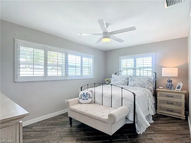 Bedroom featuring wood finish floors and a ceiling fan