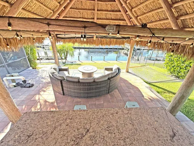 View of patio / terrace with an outdoor fire pit