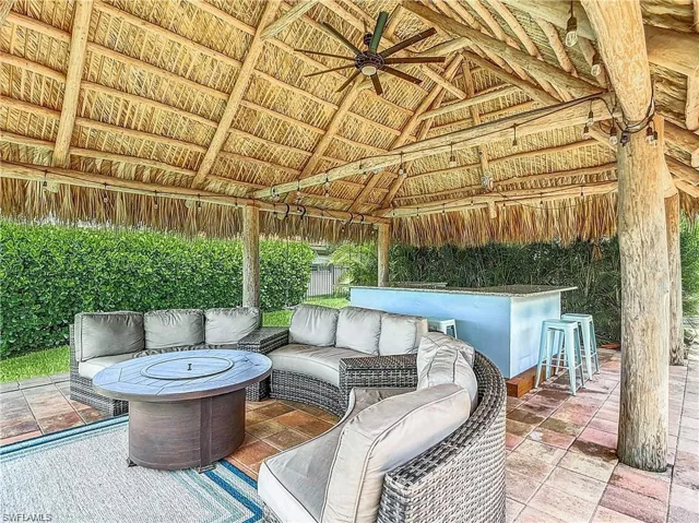 View of patio featuring a ceiling fan and an outdoor hangout area