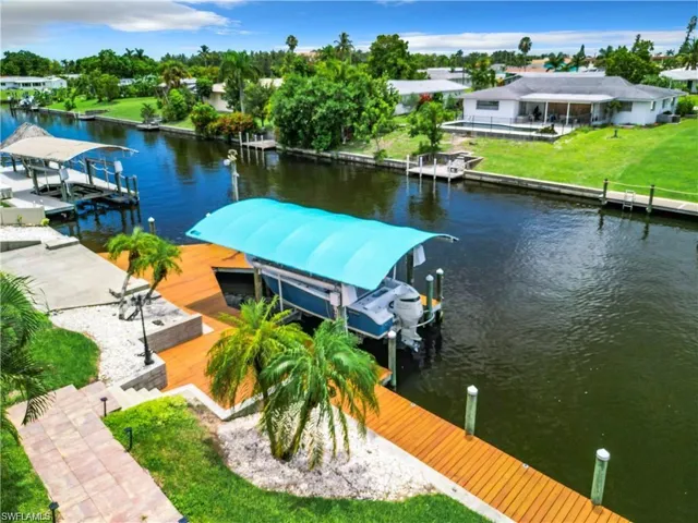 Dock with boat lift and a water view