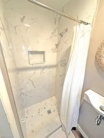 Full bathroom with a stall shower