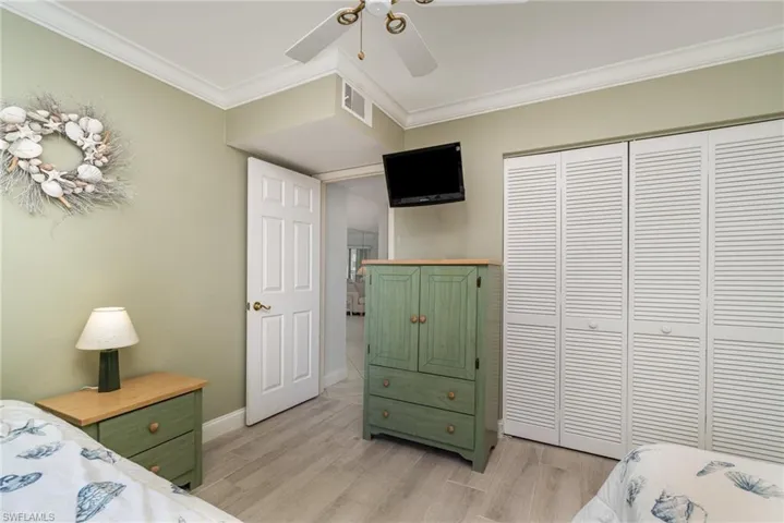 Guest bedroom with ample closet space.