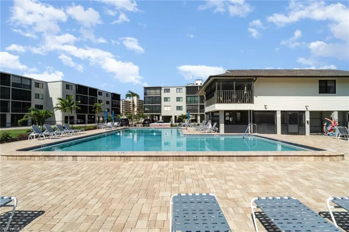 Community pool with a patio area