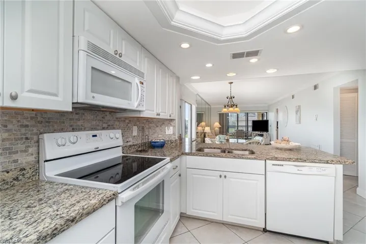 Kitchen with granite countertops.