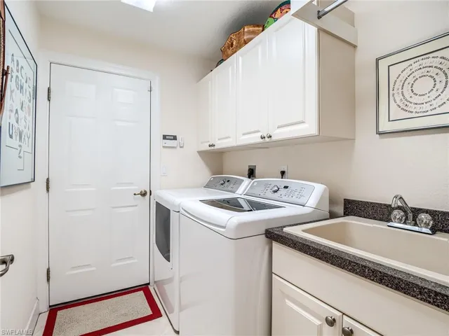 Laundry between guest bedrooms and garage